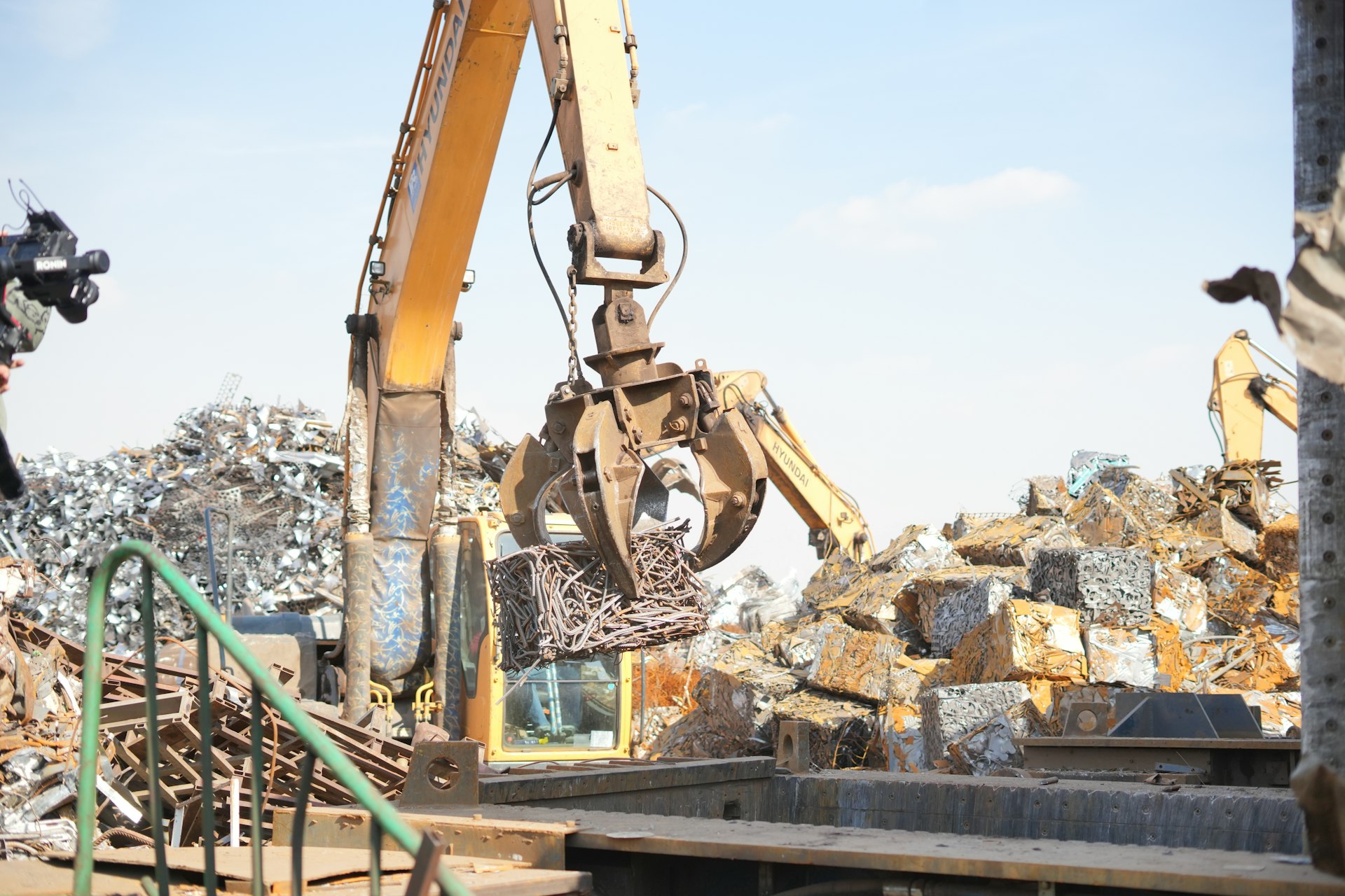 Excavator handling scrap metal